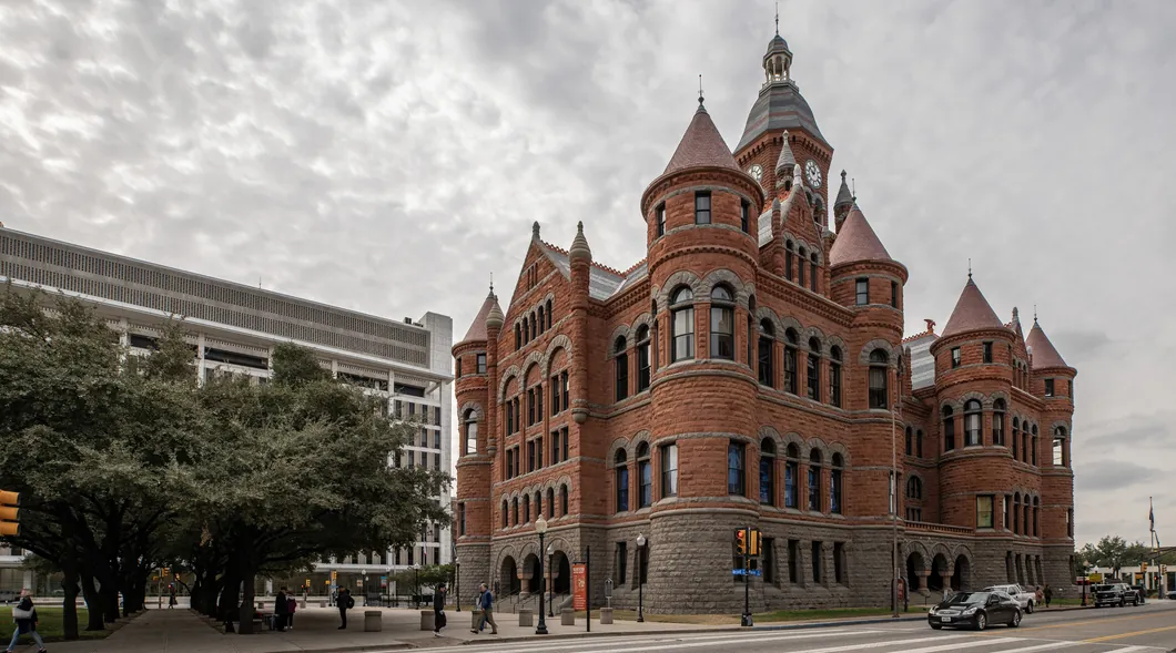 Historic red sandstone courthouse building in downtown Dallas
